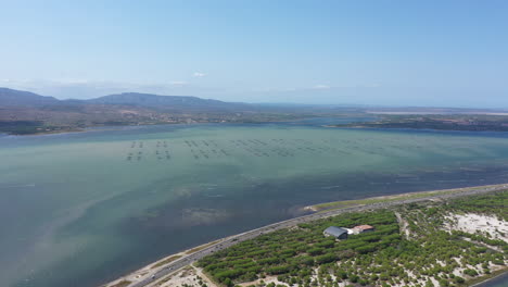 Windsurfing-spot-aerial-Leucate-lake-and-mountains-landscape-France-oyster-farms